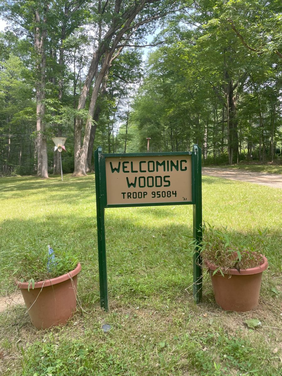 Welcoming Woods Sign